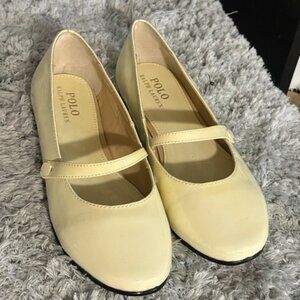 Polo Ralph Lauren patent leather Mary Jane flats in a cream or light yellow colo